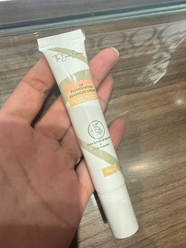 Customer's Advance Lip Pigmentation Cream tube being held in hand