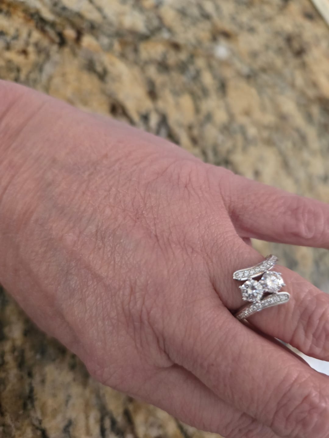 Customer photo review of Two Stone Moissanite Swirl Bypass Channel Set Engagement Ring