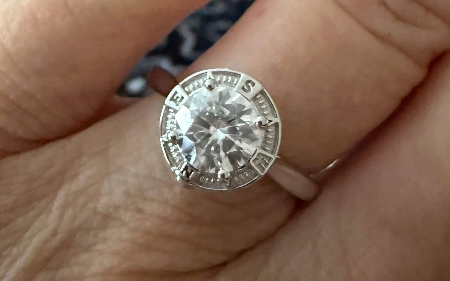 Customer photo review of North Star Halo Compass Solitaire Moissanite Engagement Ring