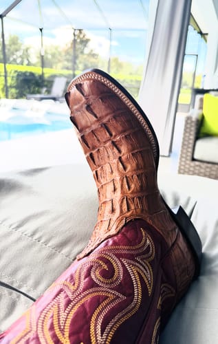 Customer's brown Hendrik Horseman western boot on a foot, showing textured leather detail.