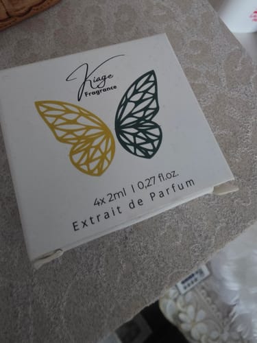 Customer's white Tester Set box featuring a gold and dark green butterfly wing design.