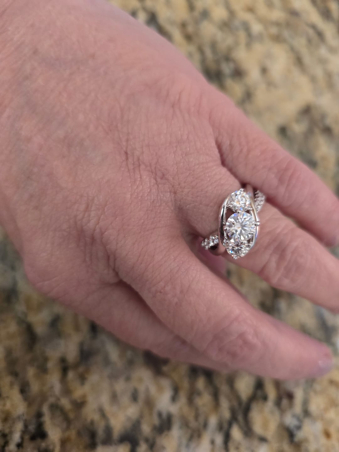 Customer photo review of Swirl Three Stone Moissanite Twisted Pave Engagement Ring