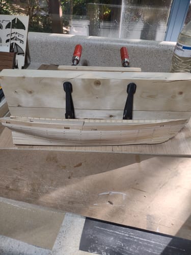 Customer's wooden hull for the Maqueta del Yate America 1851 model, held in a building jig.