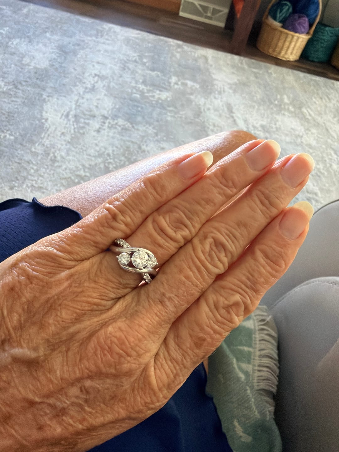 Customer photo review of Swirl Three Stone Moissanite Twisted Pave Engagement Ring