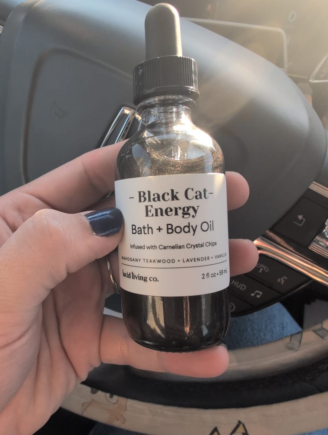 Customer photo review of Black Cat Energy Bath & Body Oil