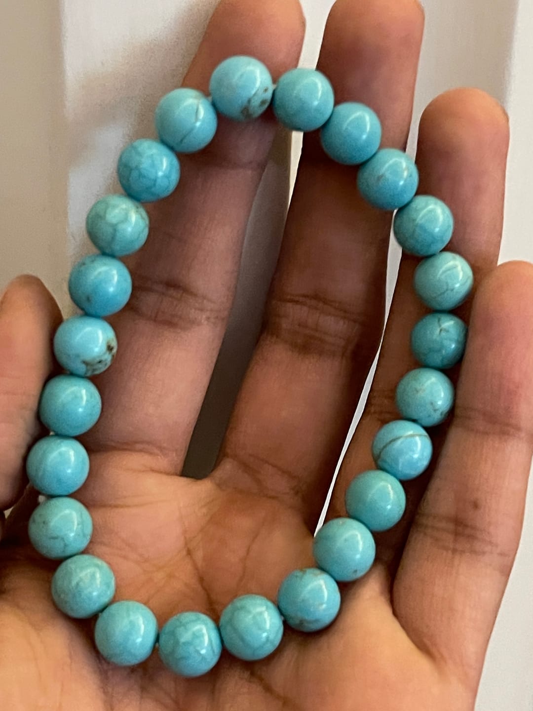 Customer photo review of Natural Turquoise/Firoza Crystal Bracelet – Vastu Remedy for Good Luck & Prosperity Protection | 8mm Beads