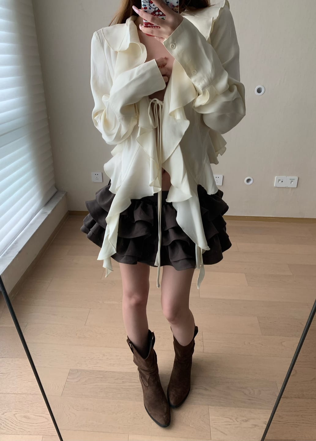 Customer photo review of Rase le sol Ivory Ruffled Tie-Front Asymmetric Blouse