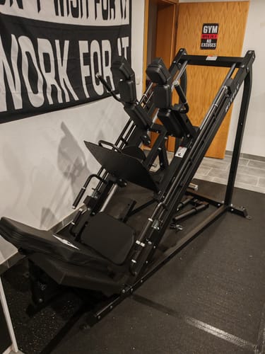 Customer's RitFit GAZELLE leg press machine, black steel, set up in a home gym area.