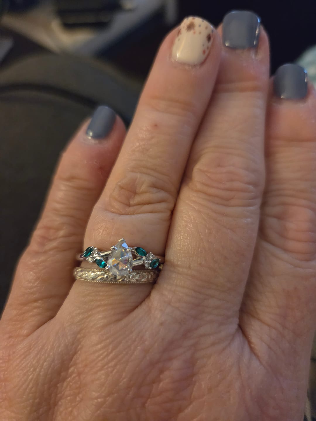 Customer photo review of Round side stones moissanite engagement ring| DovEggs