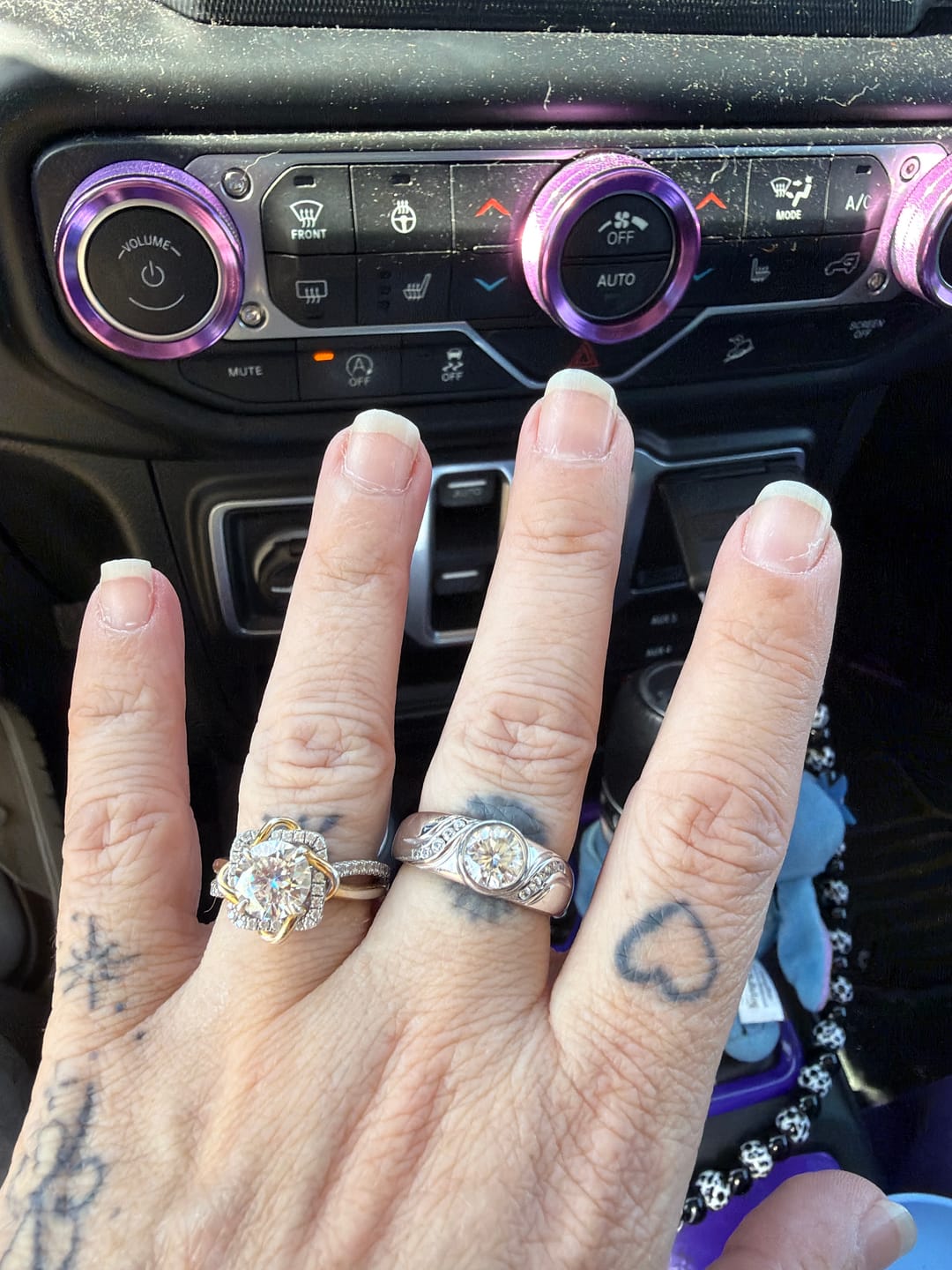 Customer photo review of Endless Flow Round Bezel Set Moissanite Wide Band Engagement Ring