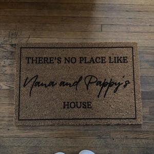 Customer photo review of There's No Place Like Nana's & Papa's House Doormat