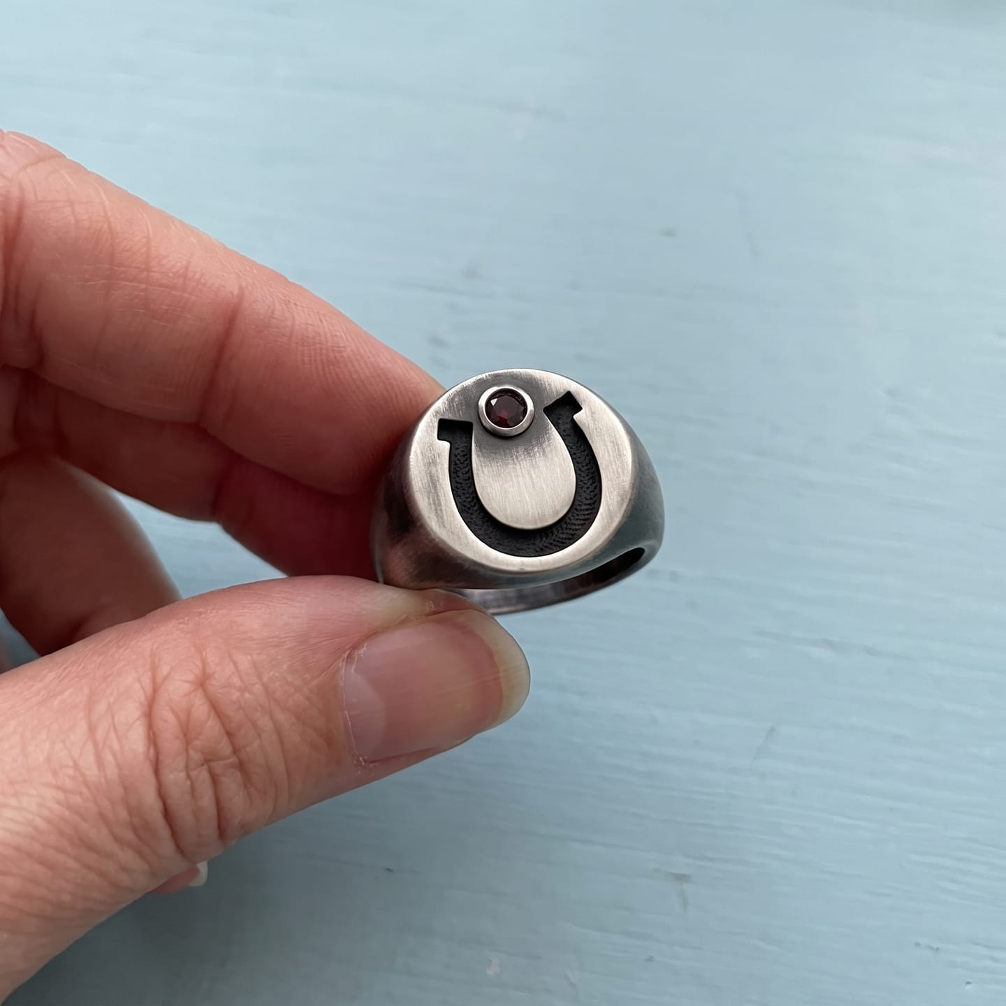 Customer photo review of Garnet Horseshoe Signet Ring