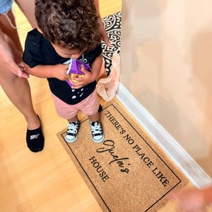 Customer photo review of There's No Place Like Nana's & Papa's House Doormat