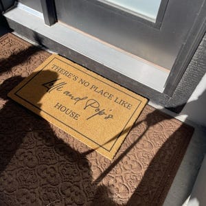 Customer photo review of There's No Place Like Nana's & Papa's House Doormat