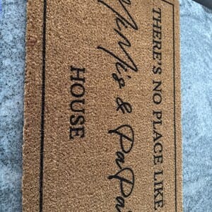 Customer photo review of There's No Place Like Nana's & Papa's House Doormat