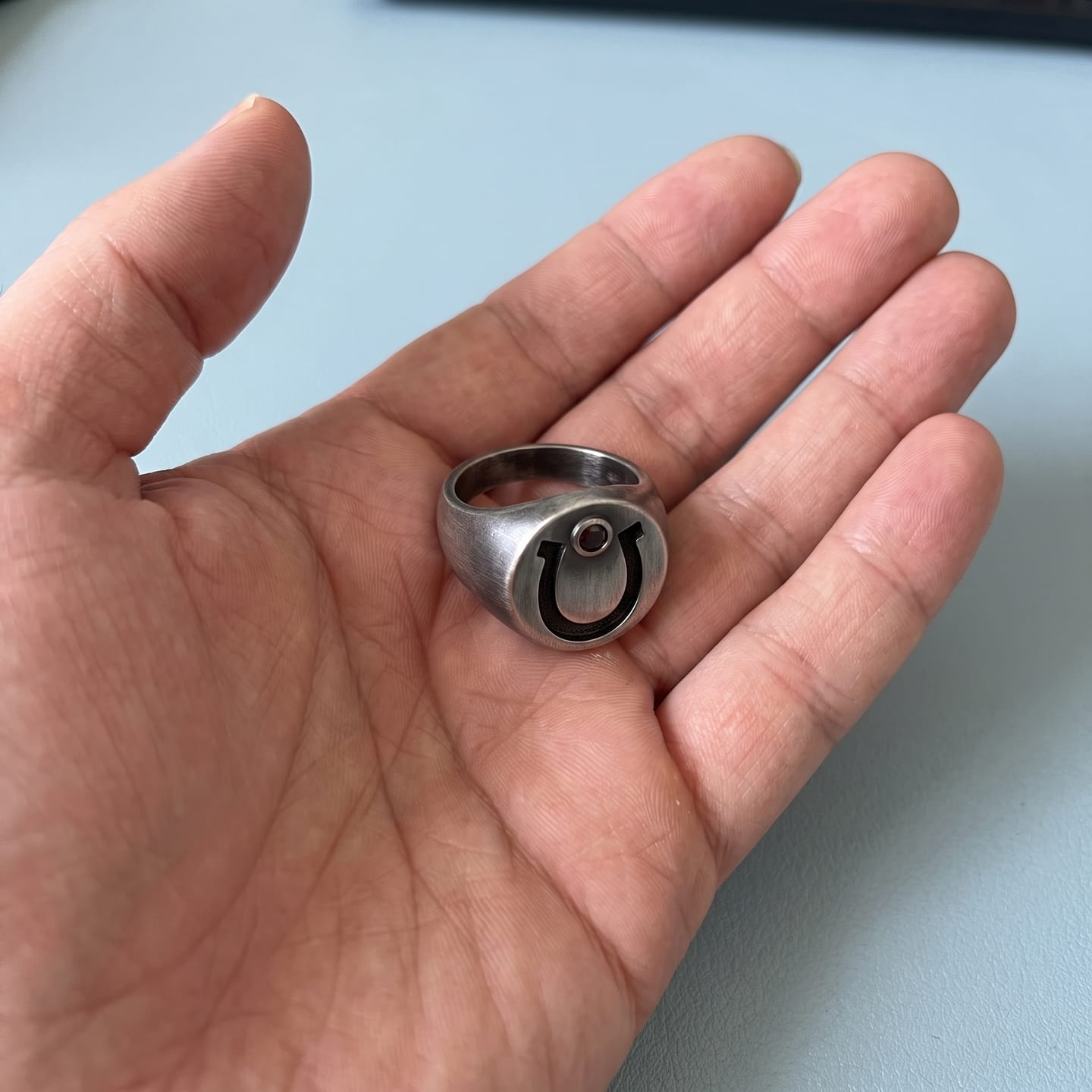Customer photo review of Garnet Horseshoe Signet Ring