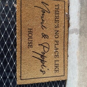 Customer photo review of There's No Place Like Nana's & Papa's House Doormat