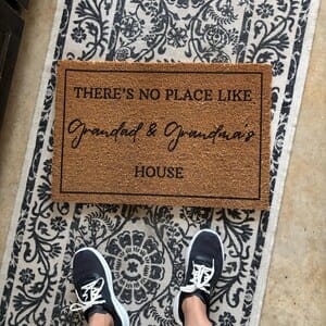 Customer photo review of There's No Place Like Nana's & Papa's House Doormat