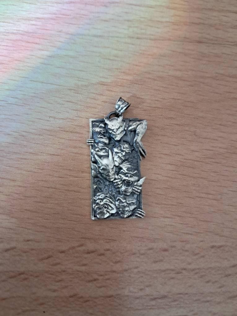 Customer photo review of Demonic Faces Pendant