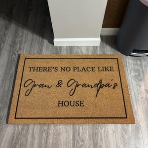 Customer photo review of There's No Place Like Nana's & Papa's House Doormat
