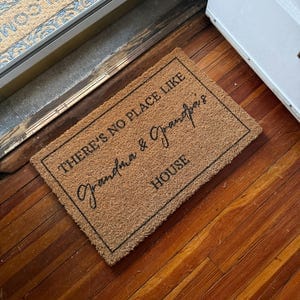 Customer photo review of There's No Place Like Nana's & Papa's House Doormat