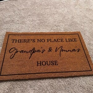 Customer photo review of There's No Place Like Nana's & Papa's House Doormat
