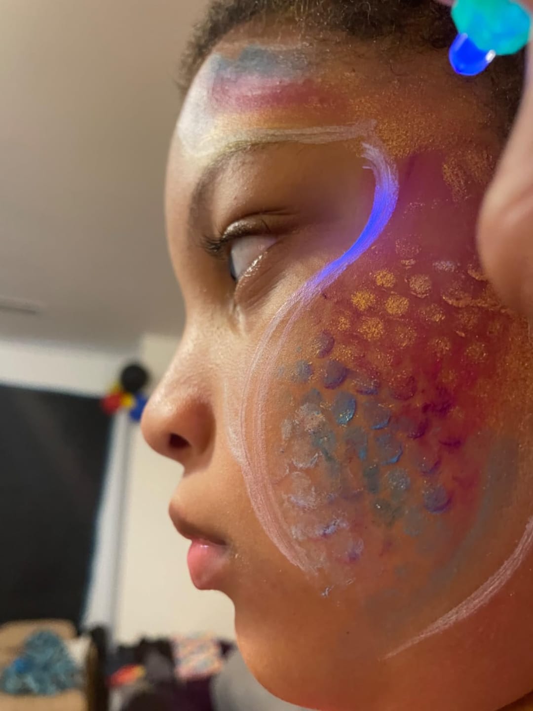 Customer photo review of Blue Squid UV Neon Face and Body Paint, Safe for Sensitive Skin, Non-Toxic UV Painting Professional Accessories Kids Adults