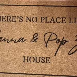 Customer photo review of There's No Place Like Nana's & Papa's House Doormat
