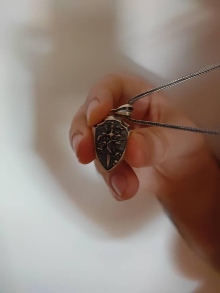 Customer photo review of Rose Sword Shield Pendant