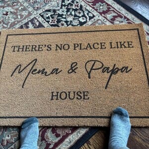 Customer photo review of There's No Place Like Nana's & Papa's House Doormat