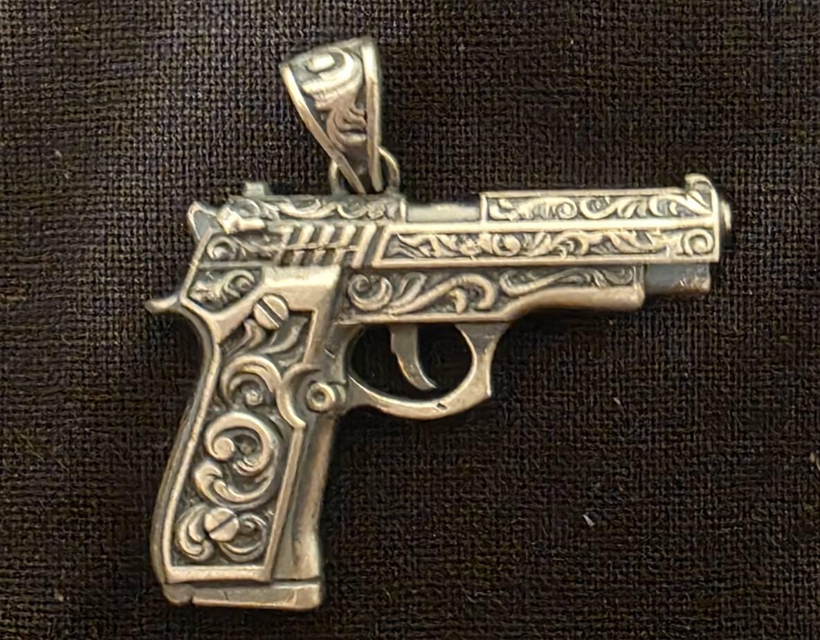 Customer photo review of Engraved Pistol Gun Pendant