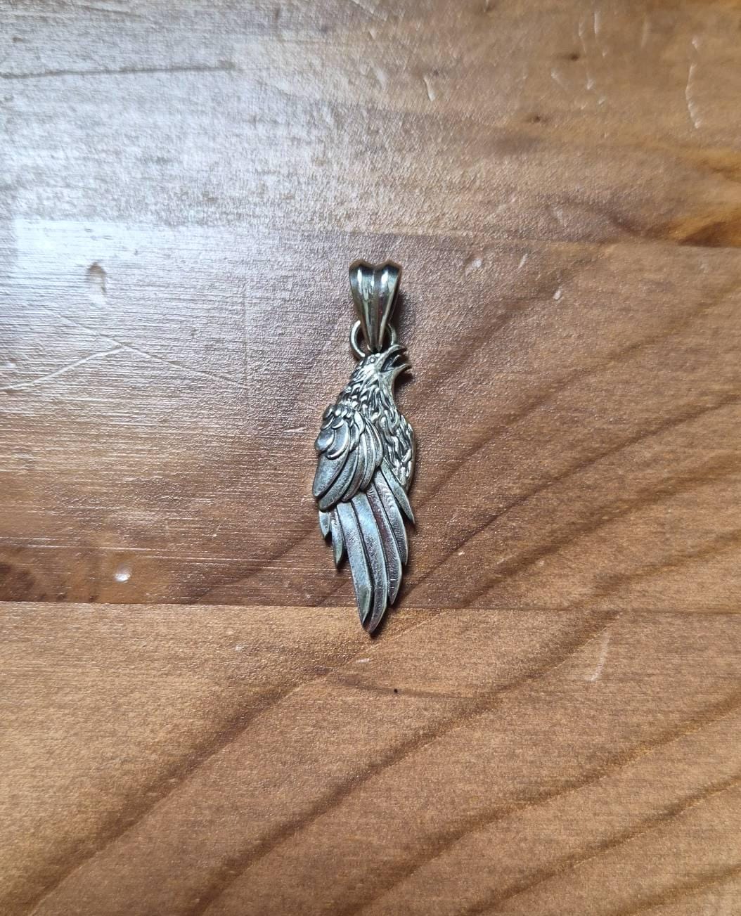 Customer photo review of Norse Raven Wing Pendant