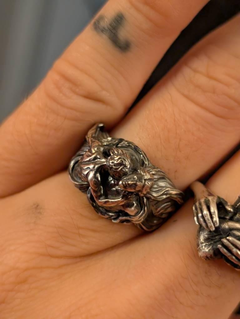 Customer photo review of Men Embracing Ring