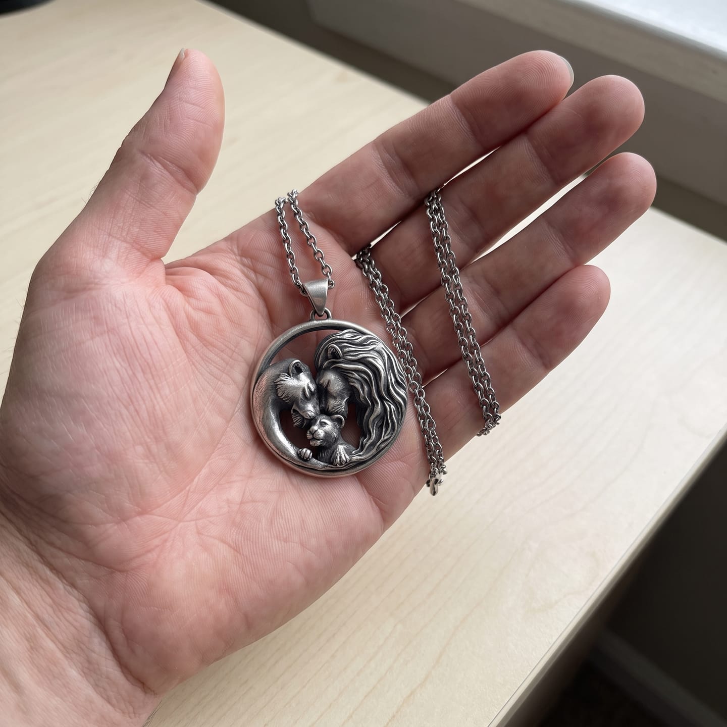 Customer photo review of Lioness and Cub Medallion Pendant