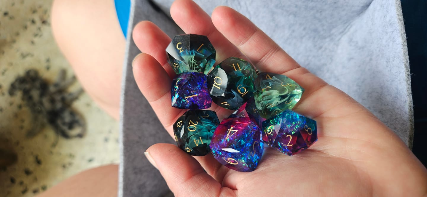 Customer photo review of URWizards D&D Resin Purple Glitter Engraved Dice Set Multi-faceted Gengar Style