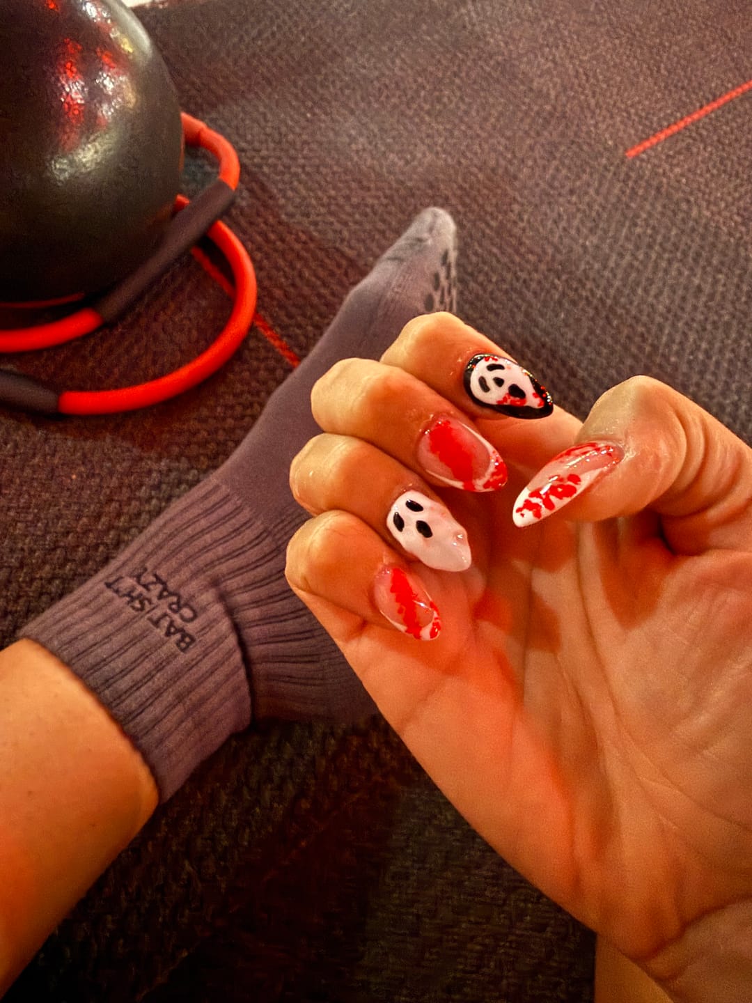 Customer photo review of Bat Sh*t Crazy Halloween Grip Socks