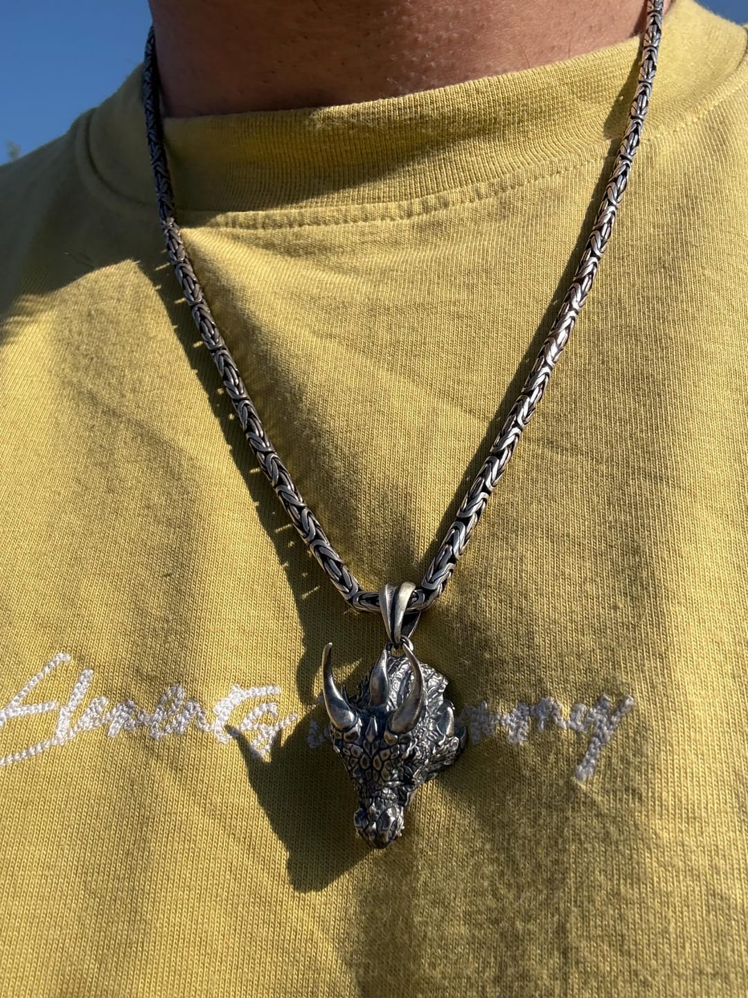 Customer photo review of Horned Dragon Head Pendant