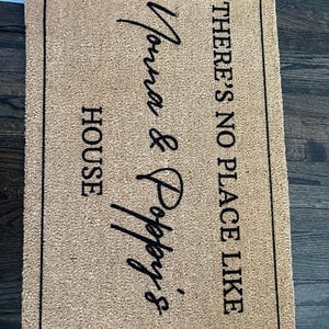 Customer photo review of There's No Place Like Nana's & Papa's House Doormat