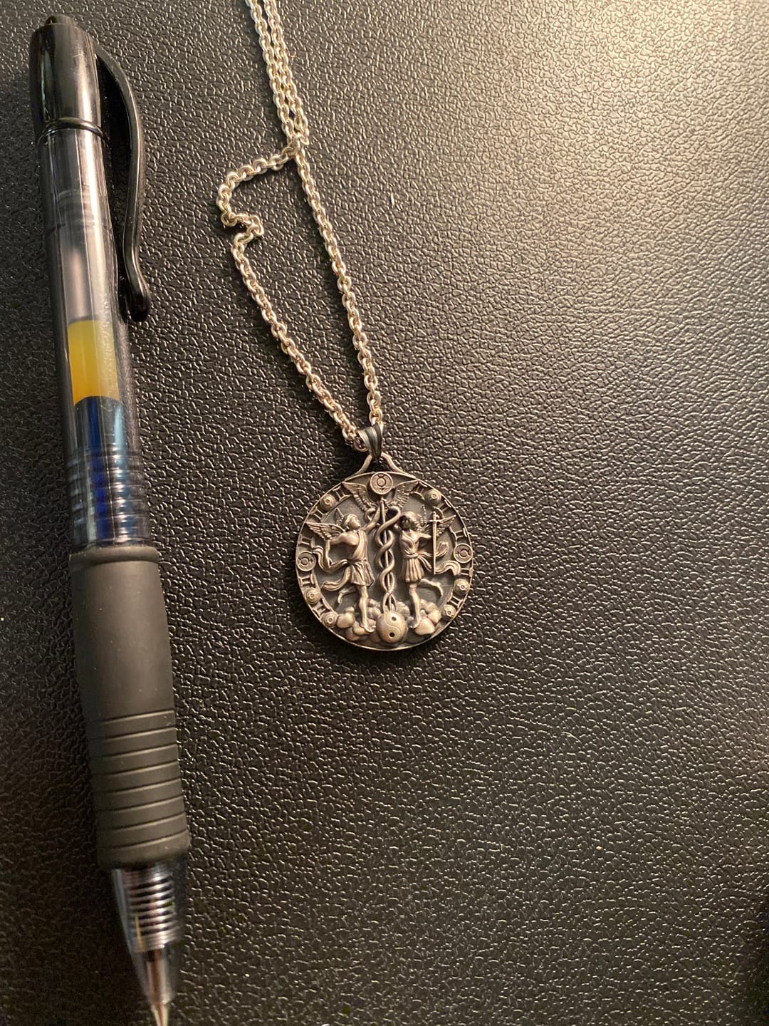 Customer photo review of Caduceus Gemini Zodiac Pendant