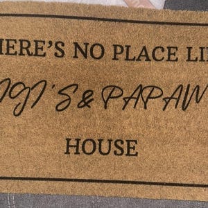 Customer photo review of There's No Place Like Nana's & Papa's House Doormat