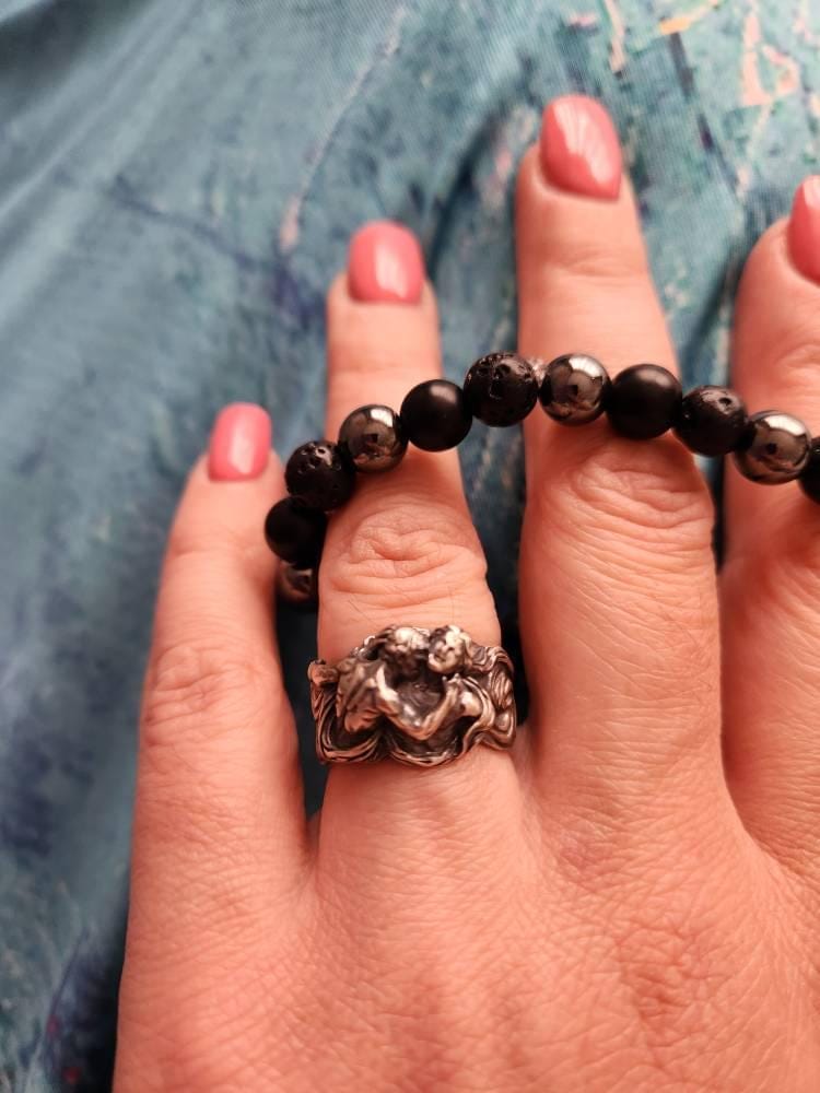 Customer photo review of Men Embracing Ring