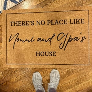 Customer photo review of There's No Place Like Nana's & Papa's House Doormat
