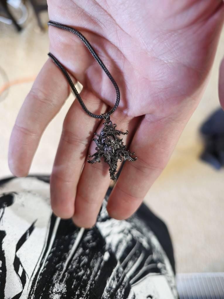 Customer photo review of Acanthus Skull Cross Pendant