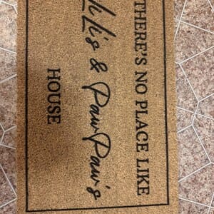 Customer photo review of There's No Place Like Nana's & Papa's House Doormat