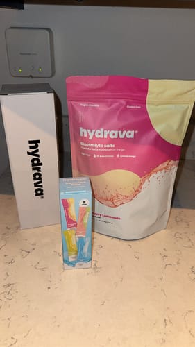 Customer's first order of hydrava electrolyte salts, showing the pink pouch and branded boxes on a countertop.