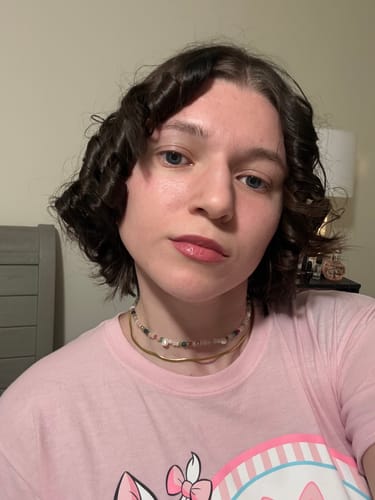 Reviewer wearing the Tropicana Pearl Necklace bundle, showing the beaded choker layered over the gold chain.