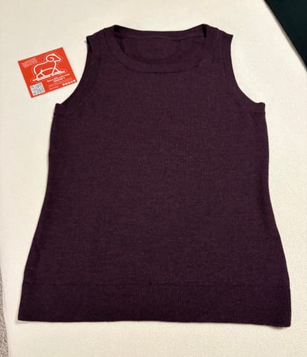 Customer's deep plum Chessy Tank Top laid flat, showing the lightweight sweater texture.
