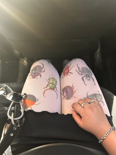 Reviewer wearing the silver chain Aries Bracelet on their wrist.