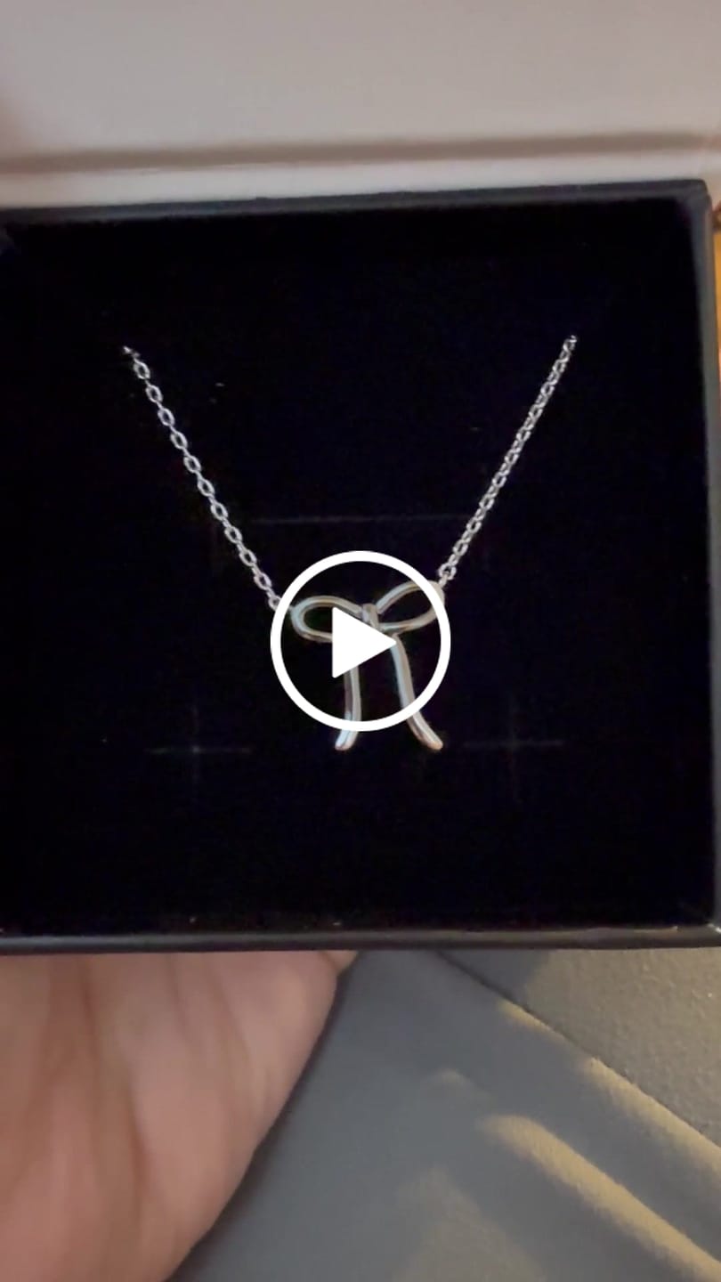 Customer video review of Lola 18k White Gold Plated Ribbon/Bow Pendant Necklace