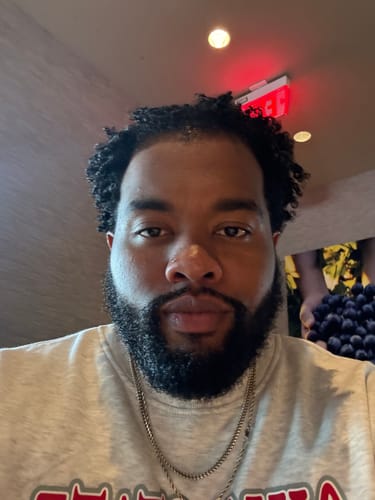 Reviewer with defined, moisturized hair after using QUENCHED Hydrating Buttercream.